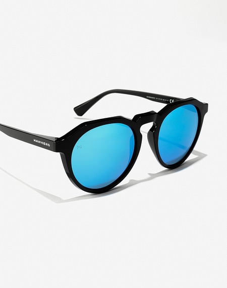Sunglasses Hawkers WARWICK RAW - BLACK CLEAR BLUE