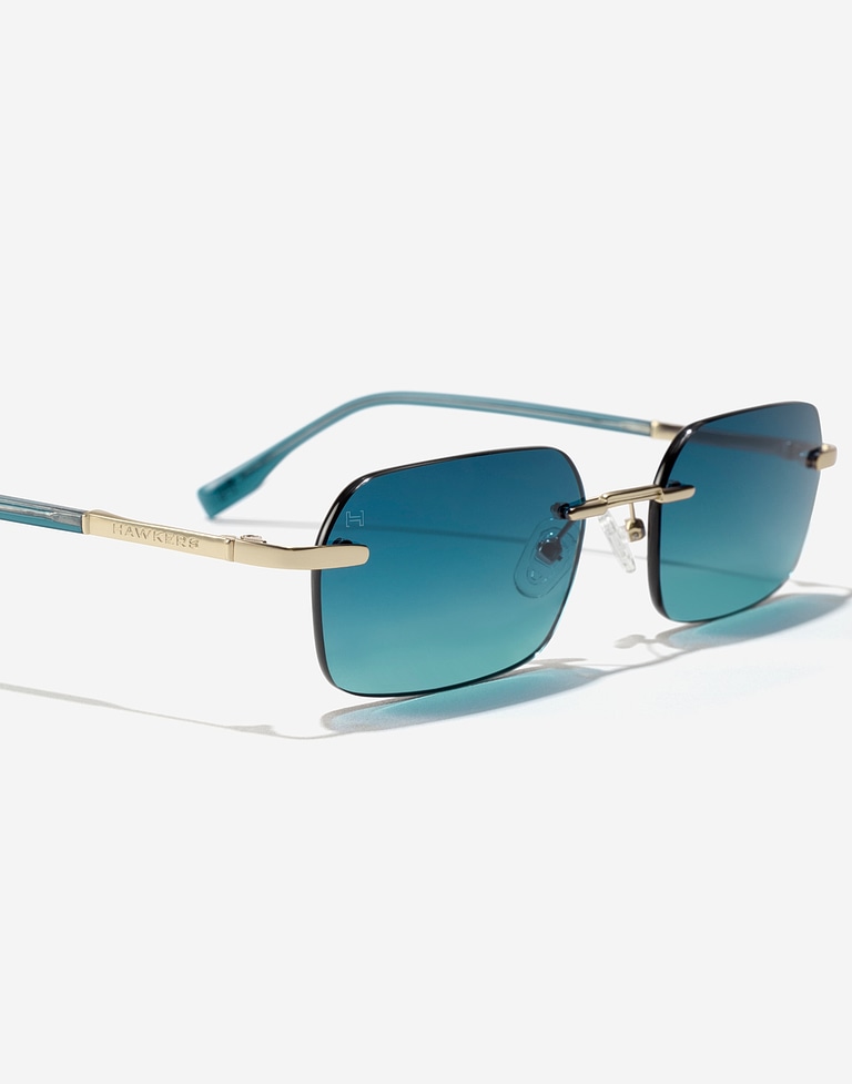 Nos Lunettes de Soleil HAWKERS ENIGMA - LIGHT GOLD BLUE TO GREEN